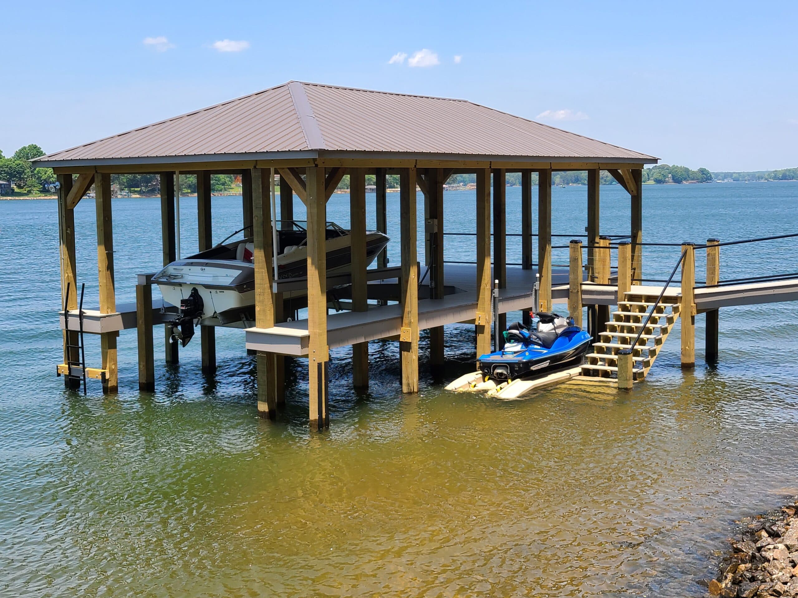 Boathouse with covered dock and jet skis