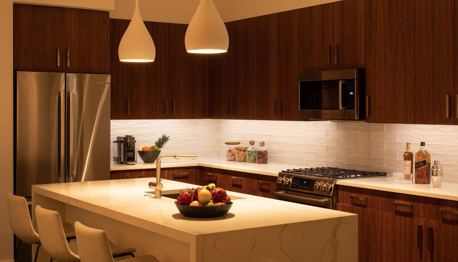Kitchen with wood cabinets and pendant lighting