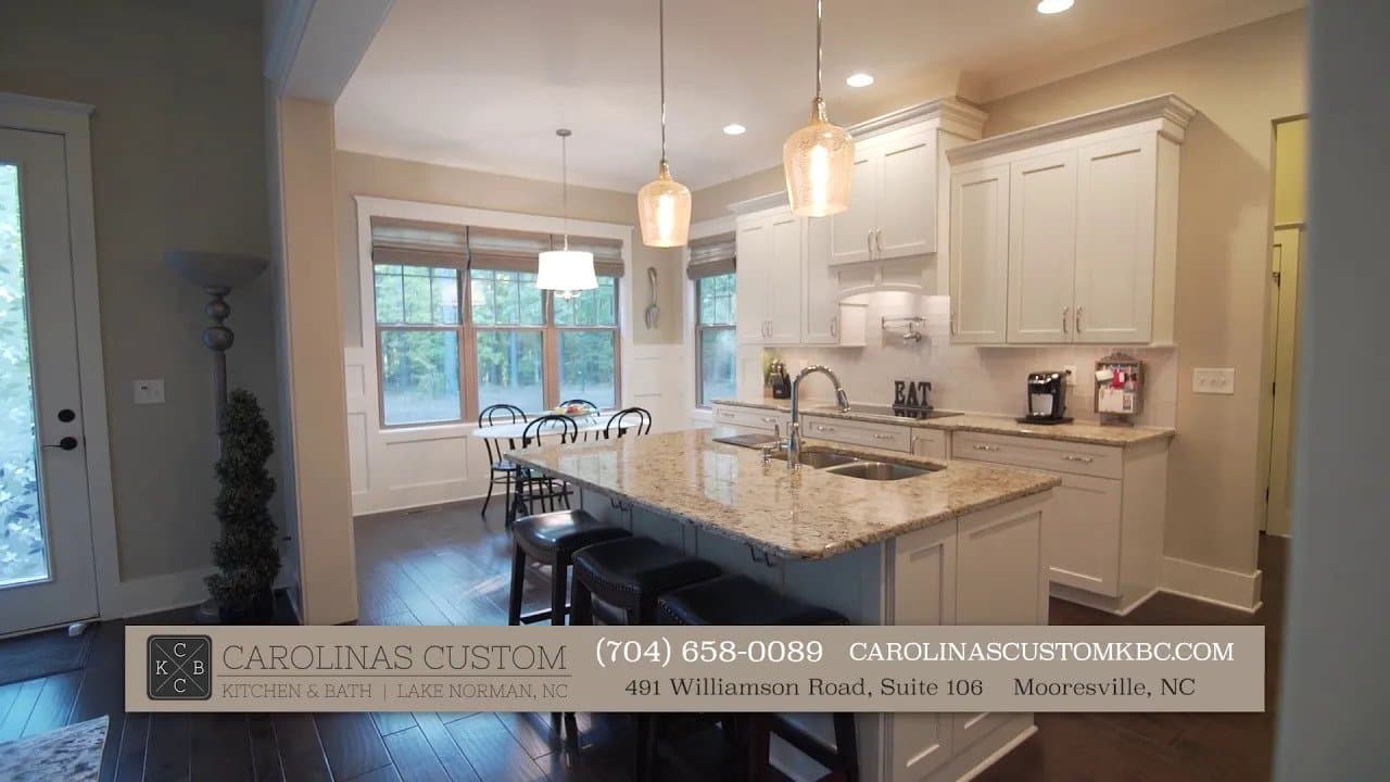 Kitchen remodel with white cabinets and granite