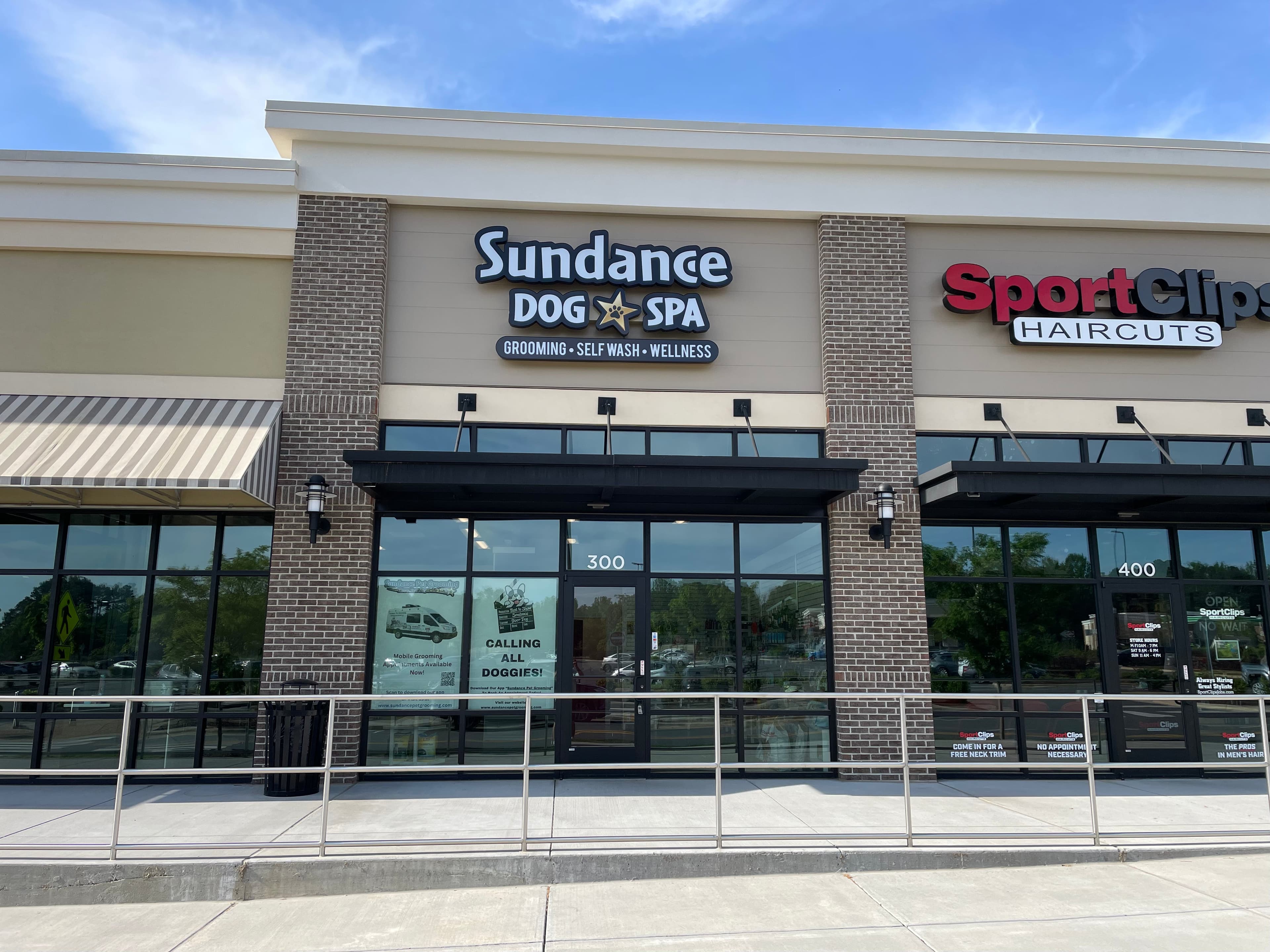 Storefront exterior with Sundance Dog Spa signage