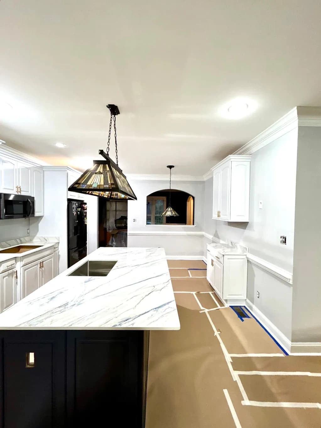 Kitchen renovation with marble countertop and cabinets