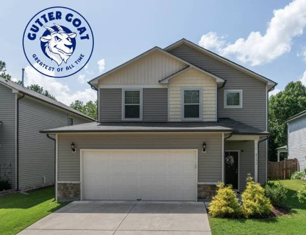 Two-story house with garage and landscaping