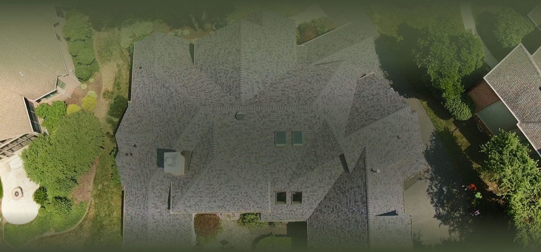 Aerial view of residential roof and property