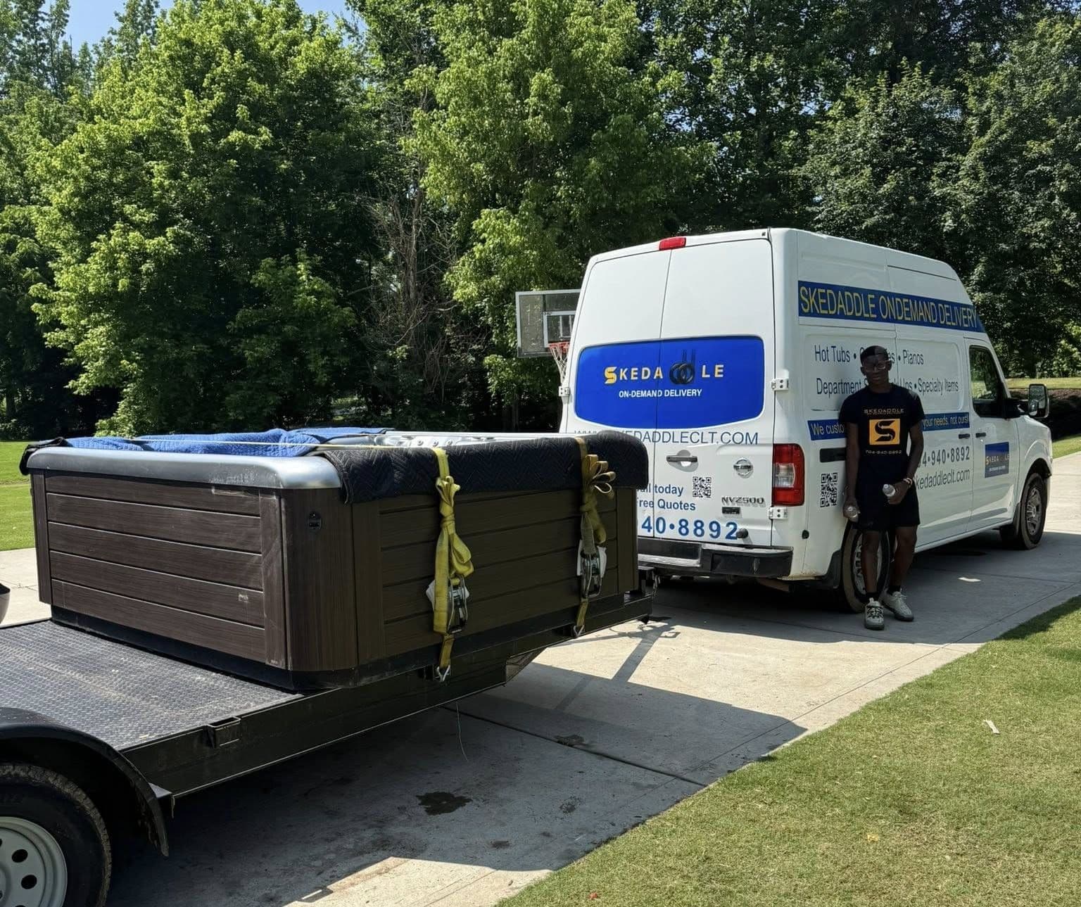 Delivery van with hot tub being loaded