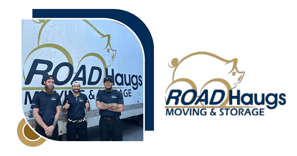 Three employees posing by moving truck