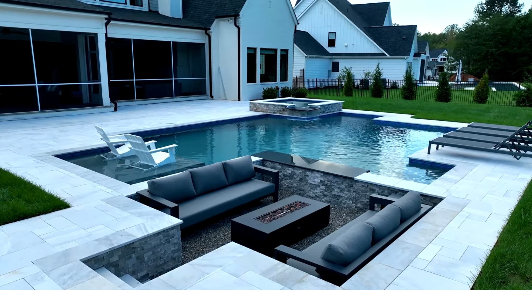 Luxury backyard pool installation with patio