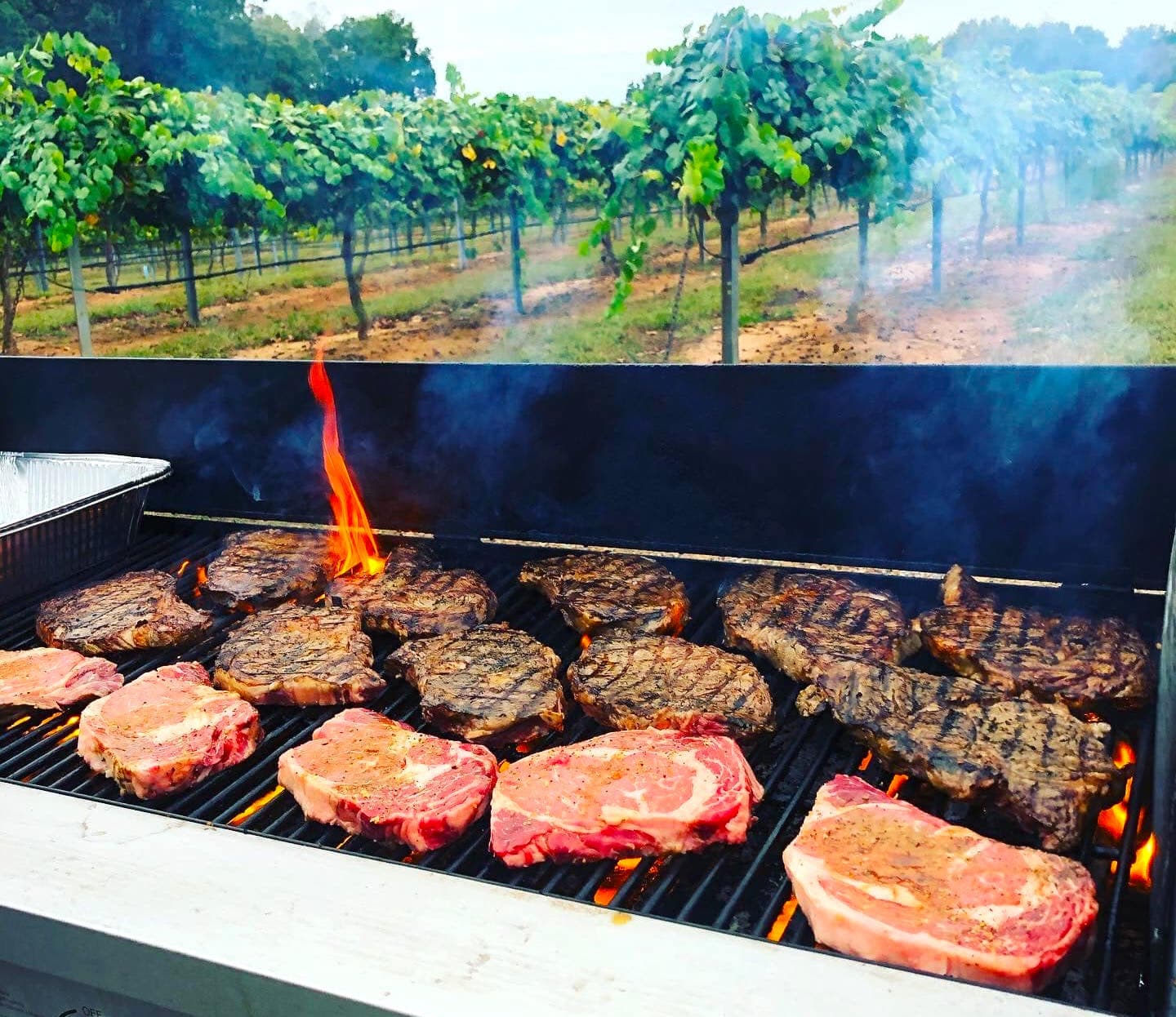 Grilled steaks and meats over open flame