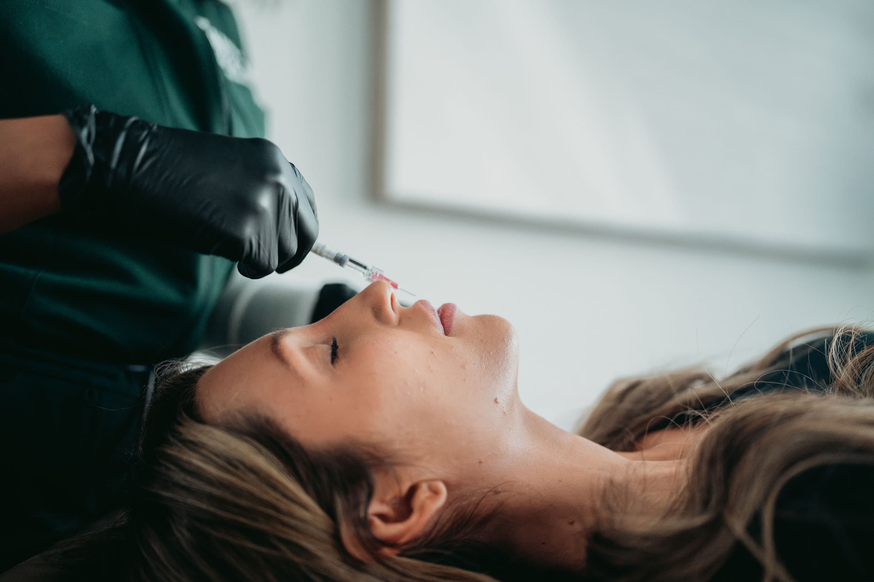 Medical aesthetics injection procedure being performed