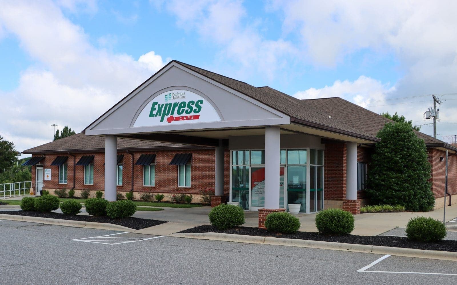 Brick building storefront with Express Care signage