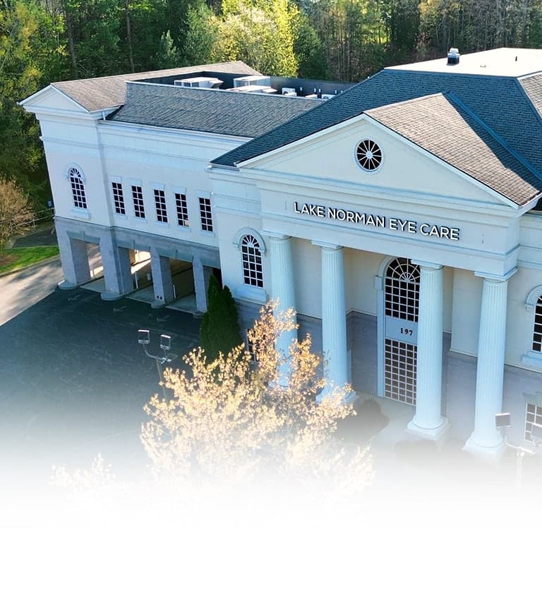 White building exterior with Lake Norman Eye Care signage