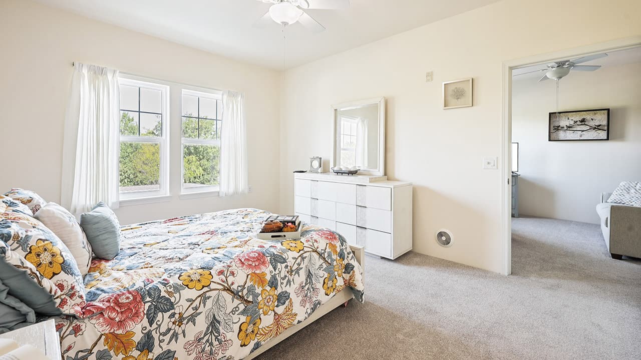 Bedroom interior with bed and windows