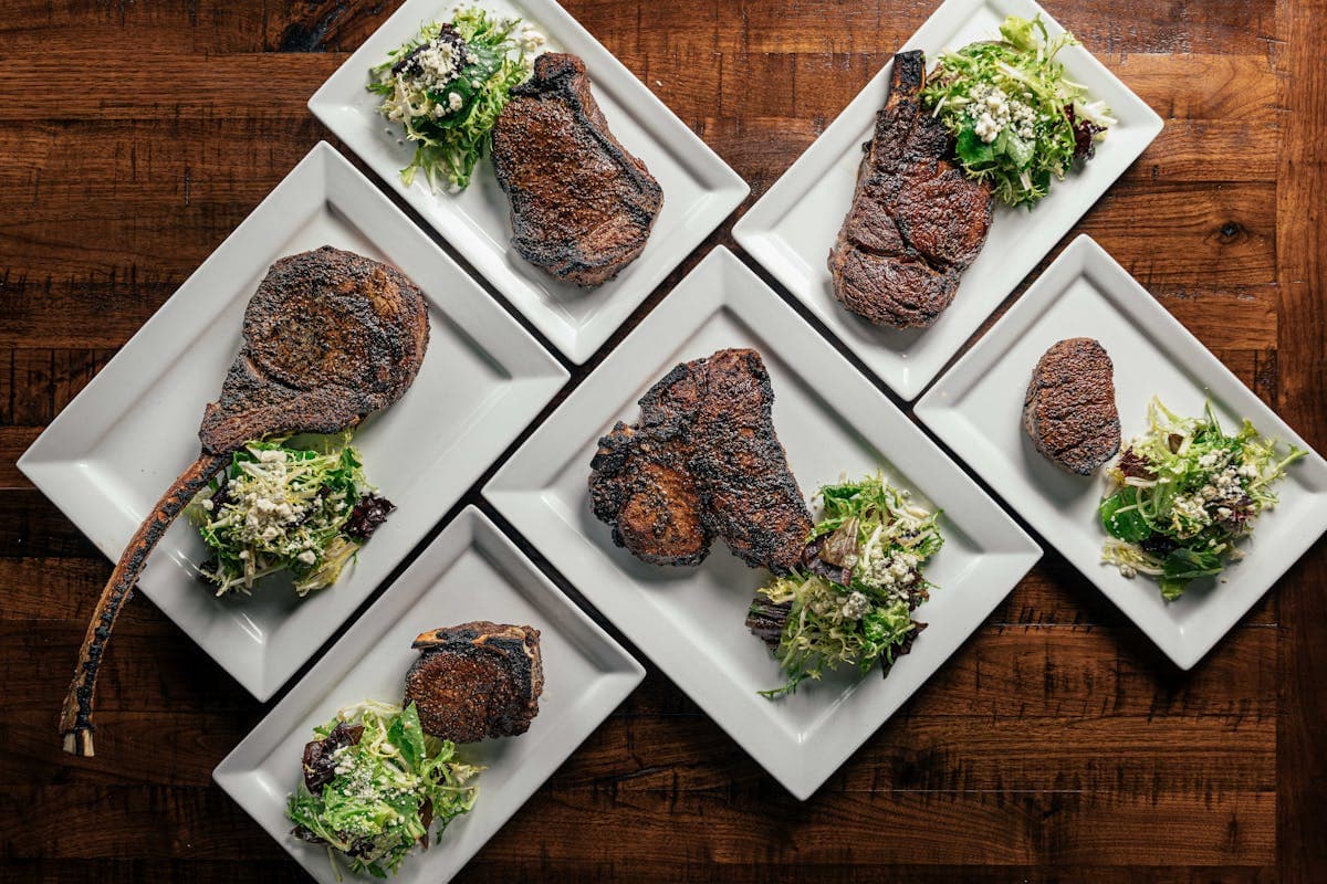 Grilled steaks with salad garnish