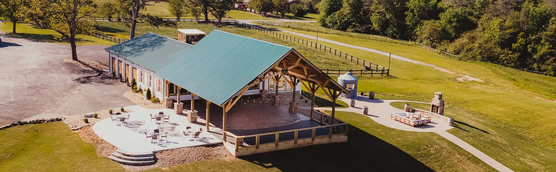 Aerial view of event venue with pavilion and grounds