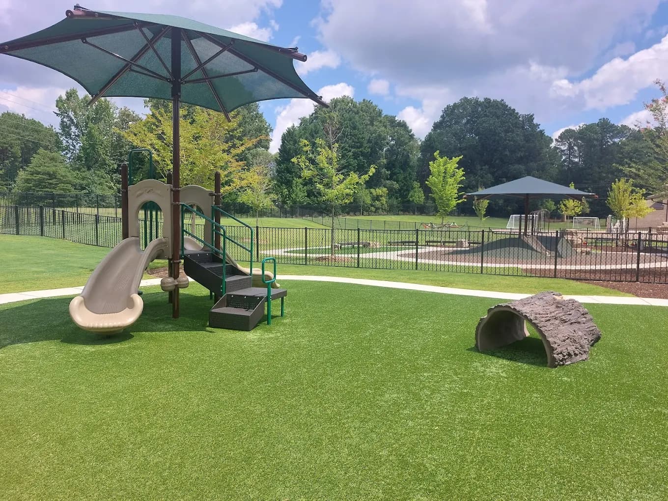 Playground with slide and umbrella structure