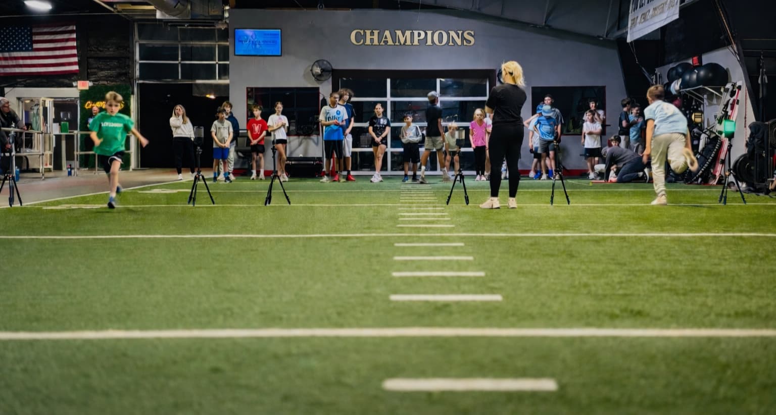 Children training on indoor football field