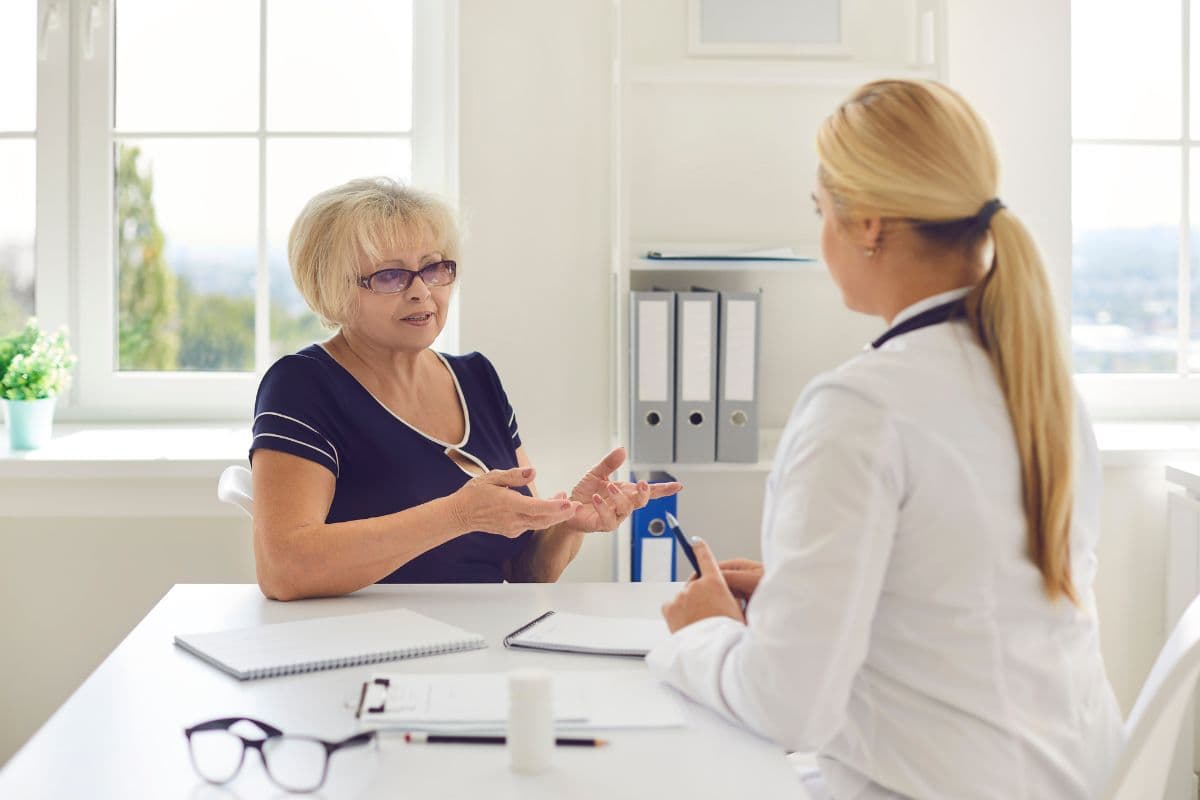 Senior woman consulting with healthcare professional