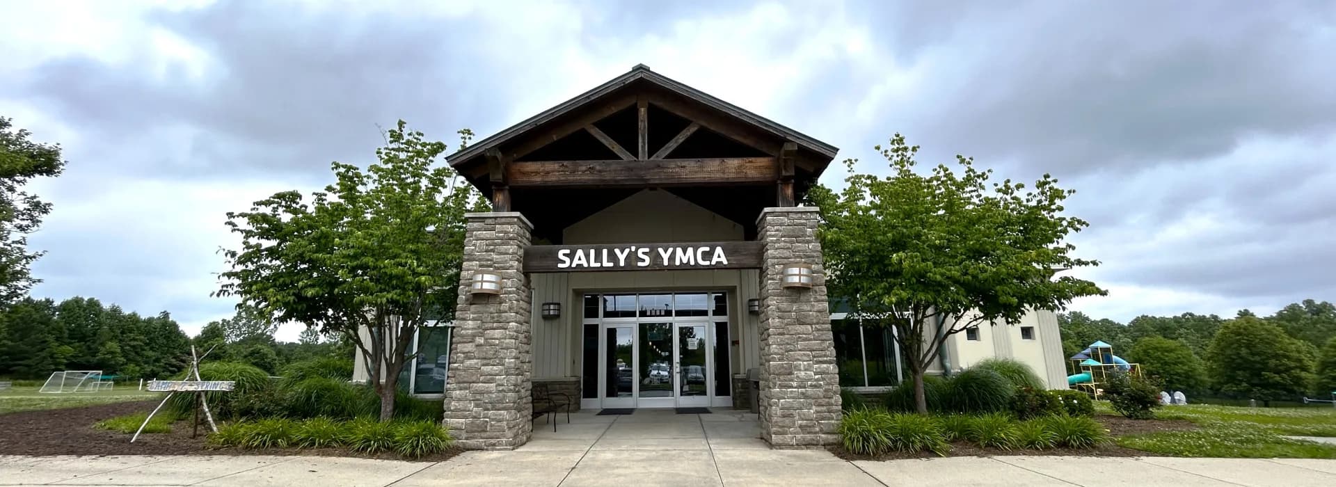 Sally's YMCA building exterior with stone entrance